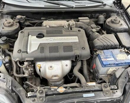 Чорний Хендай Купе, об'ємом двигуна 2 л та пробігом 112 тис. км за 5999 $, фото 9 на Automoto.ua