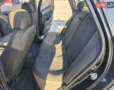 Черный Хендай Элантра, объемом двигателя 1.59 л и пробегом 213 тыс. км за 5300 $, фото 6 на Automoto.ua