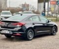 Чорний Хендай Елантра, об'ємом двигуна 2 л та пробігом 166 тис. км за 14300 $, фото 4 на Automoto.ua