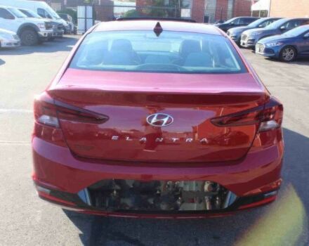 Красный Хендай Элантра, объемом двигателя 2 л и пробегом 50 тыс. км за 9400 $, фото 5 на Automoto.ua