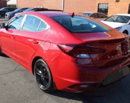 Красный Хендай Элантра, объемом двигателя 2 л и пробегом 50 тыс. км за 9400 $, фото 4 на Automoto.ua