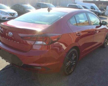 Красный Хендай Элантра, объемом двигателя 2 л и пробегом 50 тыс. км за 9400 $, фото 6 на Automoto.ua