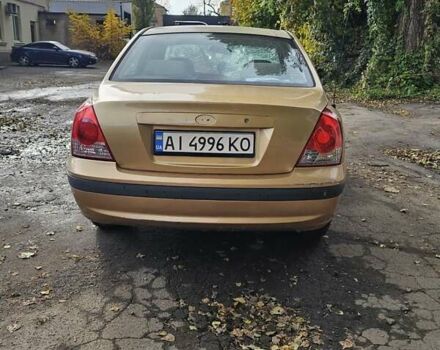 Желтый Хендай Элантра, объемом двигателя 1.99 л и пробегом 200 тыс. км за 1400 $, фото 1 на Automoto.ua