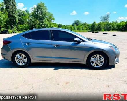 Сірий Хендай Елантра, об'ємом двигуна 2 л та пробігом 106 тис. км за 11999 $, фото 2 на Automoto.ua