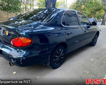 Зеленый Хендай Элантра, объемом двигателя 1.6 л и пробегом 242 тыс. км за 2700 $, фото 6 на Automoto.ua