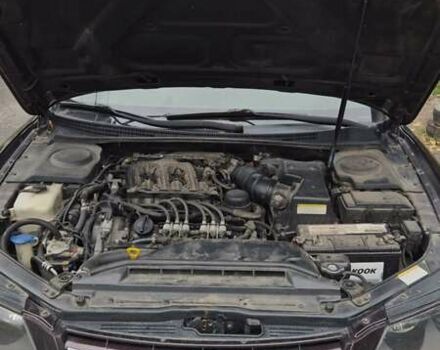 Красный Хендай Грандер, объемом двигателя 3.34 л и пробегом 243 тыс. км за 4000 $, фото 3 на Automoto.ua