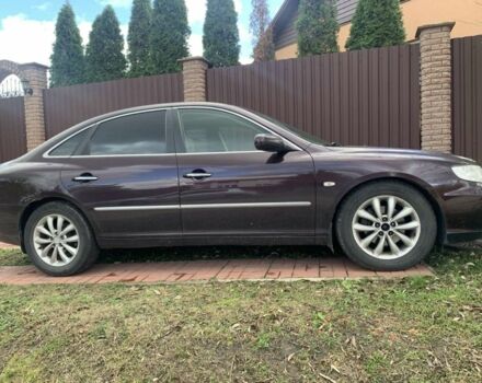 Красный Хендай Грандер, объемом двигателя 3.3 л и пробегом 400 тыс. км за 5000 $, фото 2 на Automoto.ua