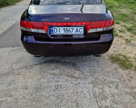 Красный Хендай Грандер, объемом двигателя 3.34 л и пробегом 289 тыс. км за 4600 $, фото 1 на Automoto.ua