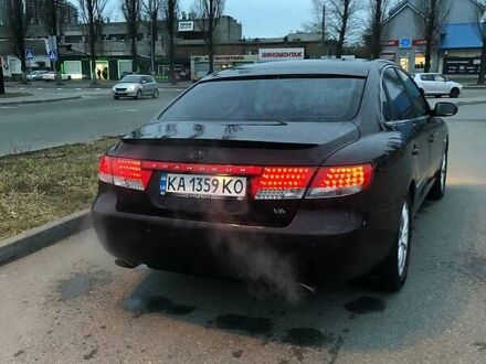 Хендай Грандер 2005 в Киеве на Automoto.ua Красный Хендай Грандер, объемом двигателя 3.3 л и пробегом 315 тыс. км за 5300 $, фото 1 на Automoto.ua