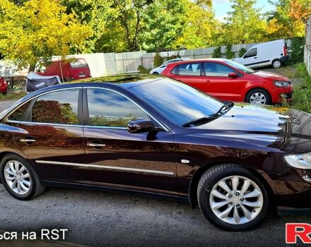 Красный Хендай Грандер, объемом двигателя 3.3 л и пробегом 280 тыс. км за 6500 $, фото 1 на Automoto.ua