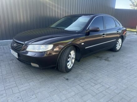 Красный Хендай Грандер, объемом двигателя 3.3 л и пробегом 228 тыс. км за 4200 $, фото 1 на Automoto.ua