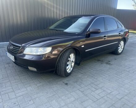 Красный Хендай Грандер, объемом двигателя 3.3 л и пробегом 228 тыс. км за 4200 $, фото 1 на Automoto.ua