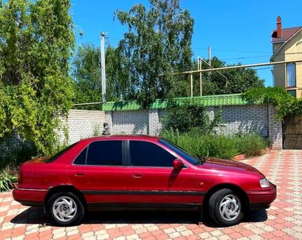 Красный Хендай Лантра, объемом двигателя 18 л и пробегом 265 тыс. км за 1000 $, фото 2 на Automoto.ua