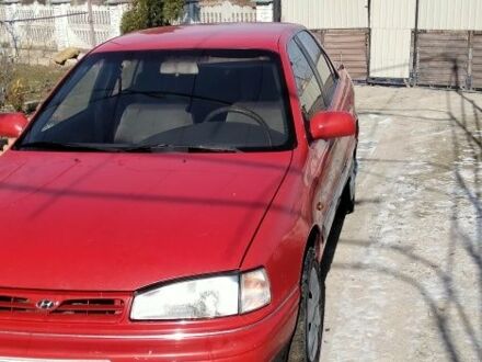 Красный Хендай Лантра, объемом двигателя 1 л и пробегом 198 тыс. км за 700 $, фото 1 на Automoto.ua