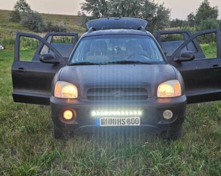 Черный Хендай Санта Фе, объемом двигателя 2 л и пробегом 305 тыс. км за 3098 $, фото 4 на Automoto.ua