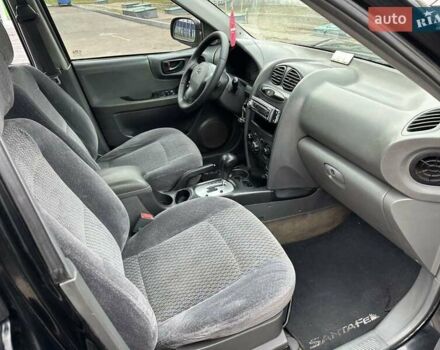Черный Хендай Санта Фе, объемом двигателя 2 л и пробегом 260 тыс. км за 5000 $, фото 1 на Automoto.ua