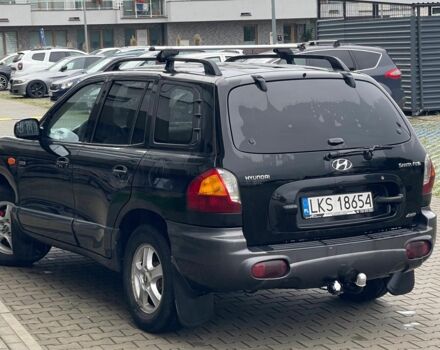 Черный Хендай Санта Фе, объемом двигателя 2 л и пробегом 300 тыс. км за 2925 $, фото 4 на Automoto.ua