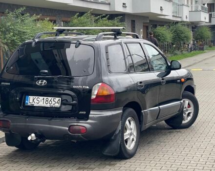 Черный Хендай Санта Фе, объемом двигателя 2 л и пробегом 300 тыс. км за 2925 $, фото 5 на Automoto.ua