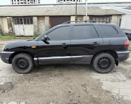 Черный Хендай Санта Фе, объемом двигателя 2 л и пробегом 278 тыс. км за 2500 $, фото 1 на Automoto.ua