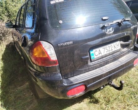 Черный Хендай Санта Фе, объемом двигателя 2.4 л и пробегом 295 тыс. км за 3100 $, фото 2 на Automoto.ua