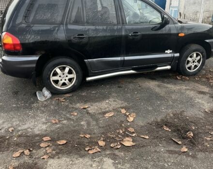 Черный Хендай Санта Фе, объемом двигателя 2.4 л и пробегом 240 тыс. км за 1900 $, фото 1 на Automoto.ua