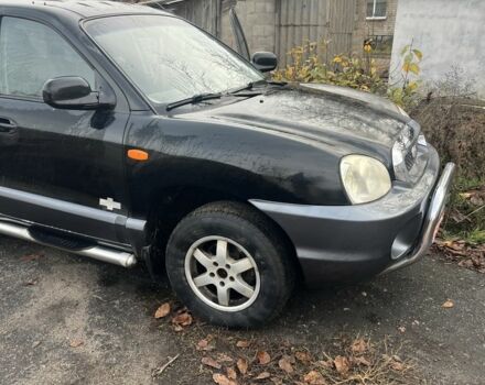 Черный Хендай Санта Фе, объемом двигателя 2.4 л и пробегом 240 тыс. км за 1900 $, фото 2 на Automoto.ua