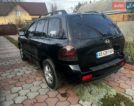 Черный Хендай Санта Фе, объемом двигателя 2.4 л и пробегом 309 тыс. км за 5900 $, фото 2 на Automoto.ua