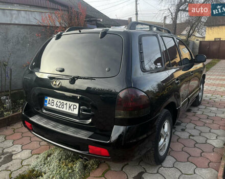 Черный Хендай Санта Фе, объемом двигателя 2.4 л и пробегом 309 тыс. км за 5900 $, фото 3 на Automoto.ua