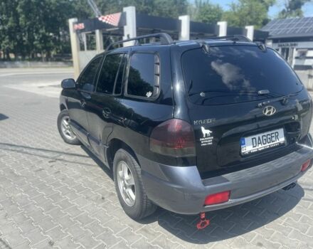 Черный Хендай Санта Фе, объемом двигателя 2.4 л и пробегом 297 тыс. км за 5700 $, фото 3 на Automoto.ua