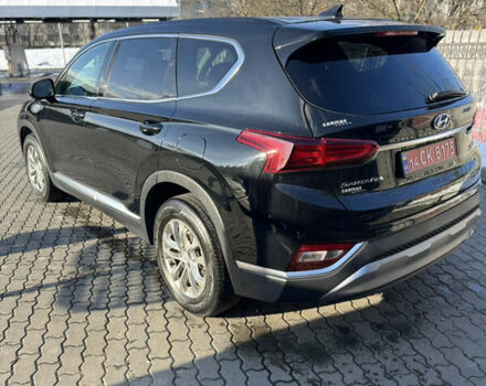 Черный Хендай Санта Фе, объемом двигателя 2.4 л и пробегом 49 тыс. км за 23000 $, фото 6 на Automoto.ua
