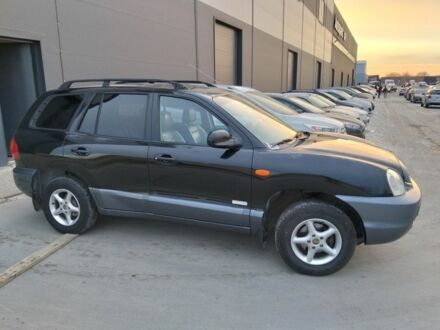 Черный Хендай Санта Фе, объемом двигателя 2.4 л и пробегом 240 тыс. км за 4400 $, фото 1 на Automoto.ua