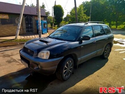 Хендай Санта Фе 2003 в Славянске на Automoto.ua Черный Хендай Санта Фе, объемом двигателя 2 л и пробегом 394 тыс. км за 5500 $, фото 1 на Automoto.ua