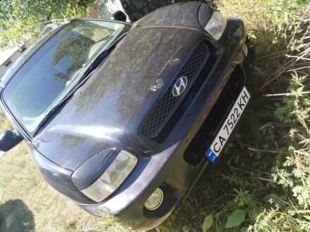 Черный Хендай Санта Фе, объемом двигателя 2.4 л и пробегом 295 тыс. км за 3100 $, фото 1 на Automoto.ua