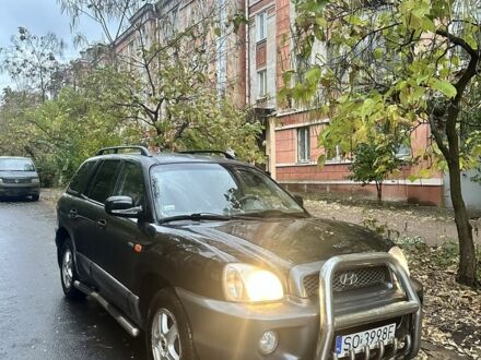 Черный Хендай Санта Фе, объемом двигателя 2 л и пробегом 323 тыс. км за 4268 $, фото 1 на Automoto.ua