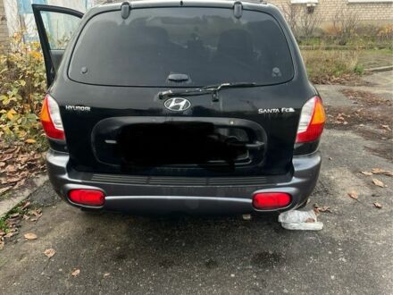 Черный Хендай Санта Фе, объемом двигателя 2.4 л и пробегом 240 тыс. км за 1900 $, фото 1 на Automoto.ua
