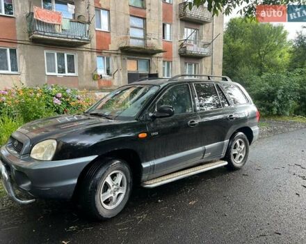 Черный Хендай Санта Фе, объемом двигателя 2 л и пробегом 266 тыс. км за 4000 $, фото 1 на Automoto.ua