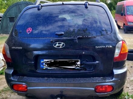 Черный Хендай Санта Фе, объемом двигателя 2 л и пробегом 350 тыс. км за 4200 $, фото 1 на Automoto.ua