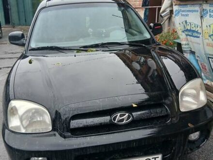 Чорний Хендай Санта Фе, об'ємом двигуна 1.99 л та пробігом 190 тис. км за 6000 $, фото 1 на Automoto.ua