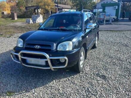 Черный Хендай Санта Фе, объемом двигателя 2.35 л и пробегом 313 тыс. км за 5500 $, фото 1 на Automoto.ua