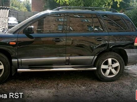 Черный Хендай Санта Фе, объемом двигателя 2 л и пробегом 200 тыс. км за 5100 $, фото 1 на Automoto.ua