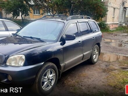 Черный Хендай Санта Фе, объемом двигателя 2.4 л и пробегом 330 тыс. км за 6300 $, фото 1 на Automoto.ua