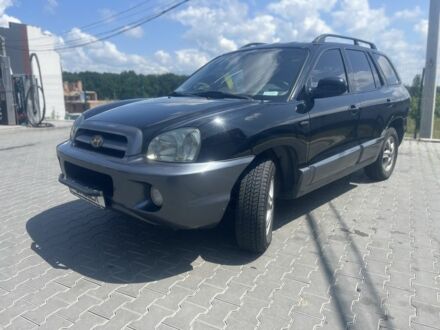 Чорний Хендай Санта Фе, об'ємом двигуна 2.4 л та пробігом 297 тис. км за 5700 $, фото 1 на Automoto.ua