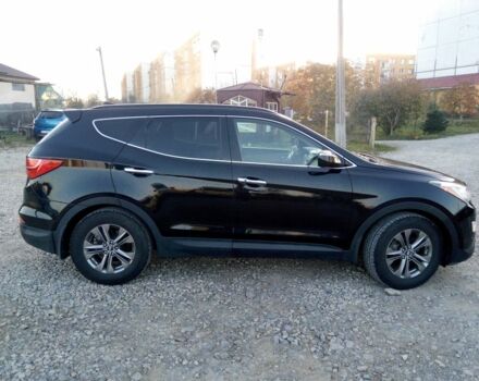 Черный Хендай Санта Фе, объемом двигателя 2.4 л и пробегом 136 тыс. км за 13669 $, фото 1 на Automoto.ua