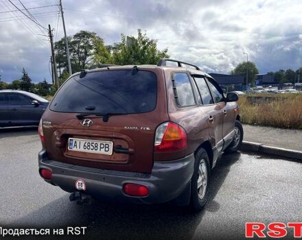 Коричневый Хендай Санта Фе, объемом двигателя 2.4 л и пробегом 250 тыс. км за 4999 $, фото 1 на Automoto.ua