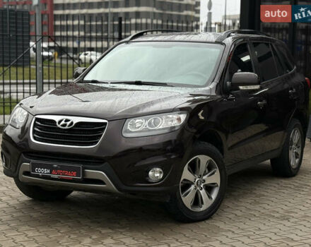 Коричневый Хендай Санта Фе, объемом двигателя 2.36 л и пробегом 195 тыс. км за 11900 $, фото 1 на Automoto.ua