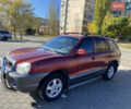 Красный Хендай Санта Фе, объемом двигателя 2.4 л и пробегом 256 тыс. км за 4000 $, фото 2 на Automoto.ua
