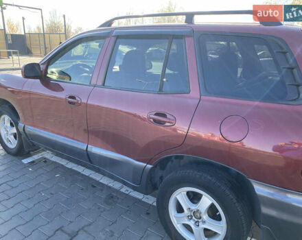 Красный Хендай Санта Фе, объемом двигателя 2.4 л и пробегом 256 тыс. км за 4000 $, фото 5 на Automoto.ua