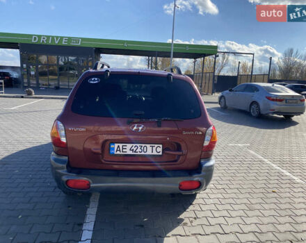 Красный Хендай Санта Фе, объемом двигателя 2.4 л и пробегом 256 тыс. км за 4000 $, фото 4 на Automoto.ua