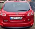 Красный Хендай Санта Фе, объемом двигателя 2.4 л и пробегом 210 тыс. км за 12000 $, фото 1 на Automoto.ua