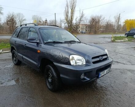 Серый Хендай Санта Фе, объемом двигателя 2 л и пробегом 333 тыс. км за 2000 $, фото 1 на Automoto.ua